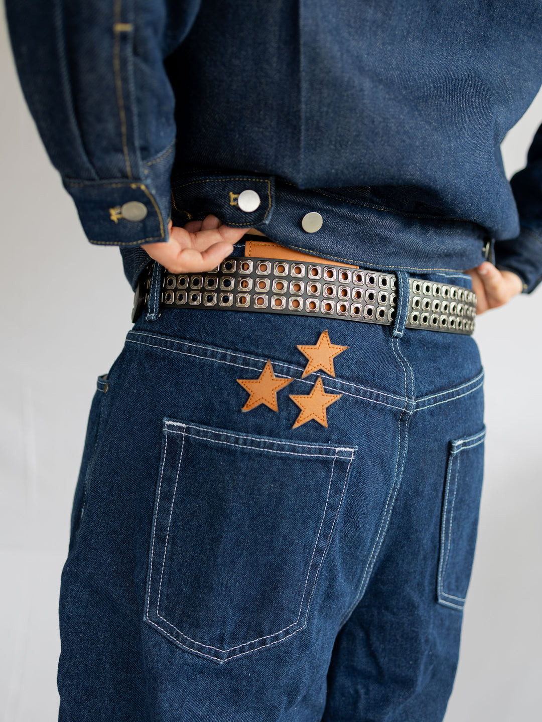 Ceinture à œillets à triple rangée