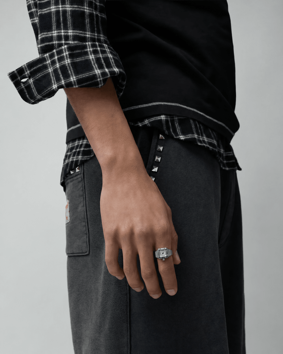Rynor Bozhi Square Watch Ring – silver-tone square watch ring with white dial, worn by a model
