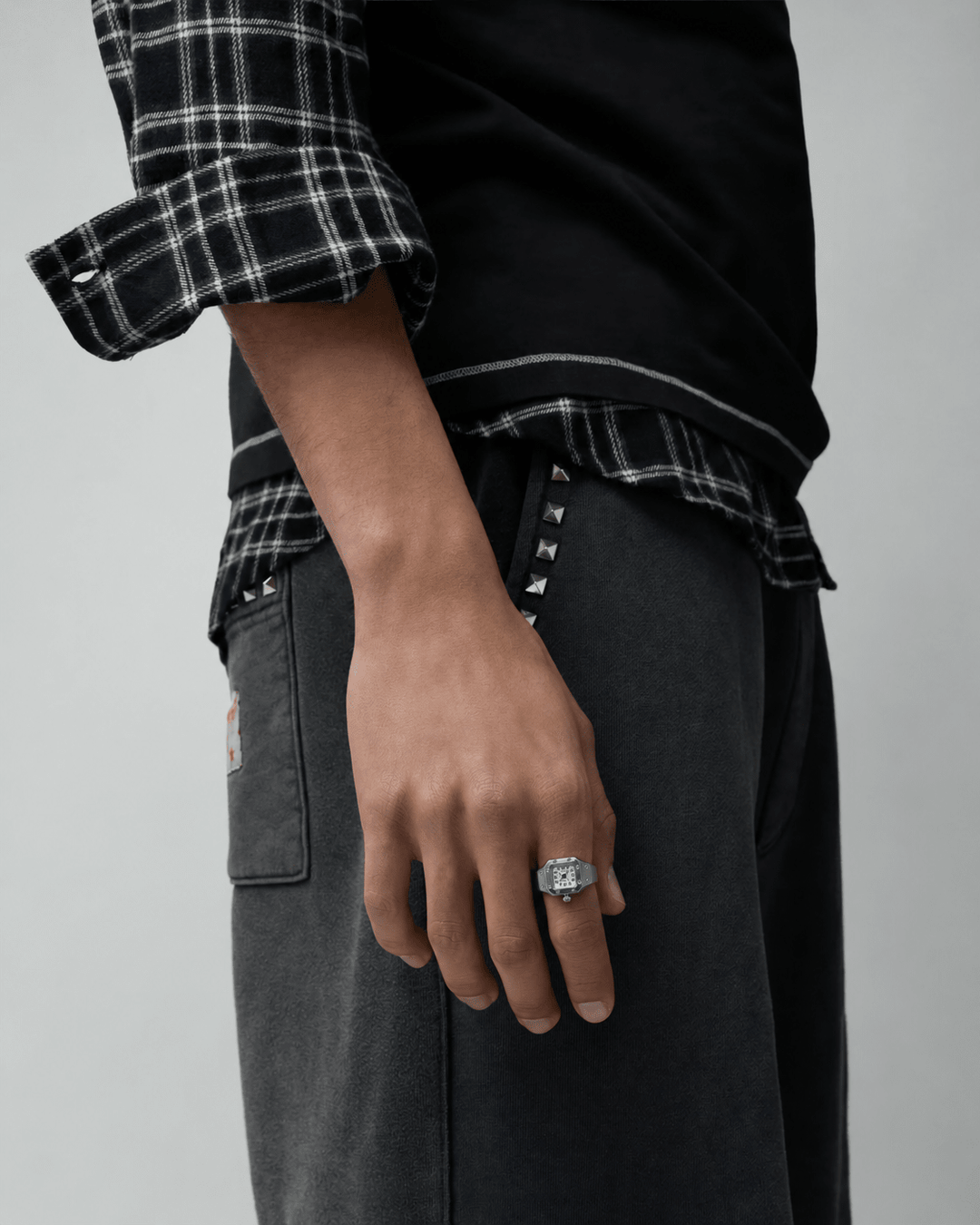 Rynor Bozhi Square Watch Ring – silver-tone square watch ring with white dial, worn by a model