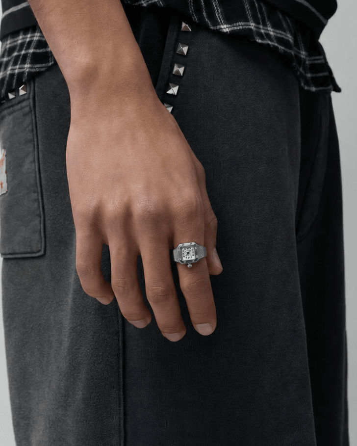 Rynor Bozhi Square Watch Ring – silver-tone square watch ring with white dial, worn by a model