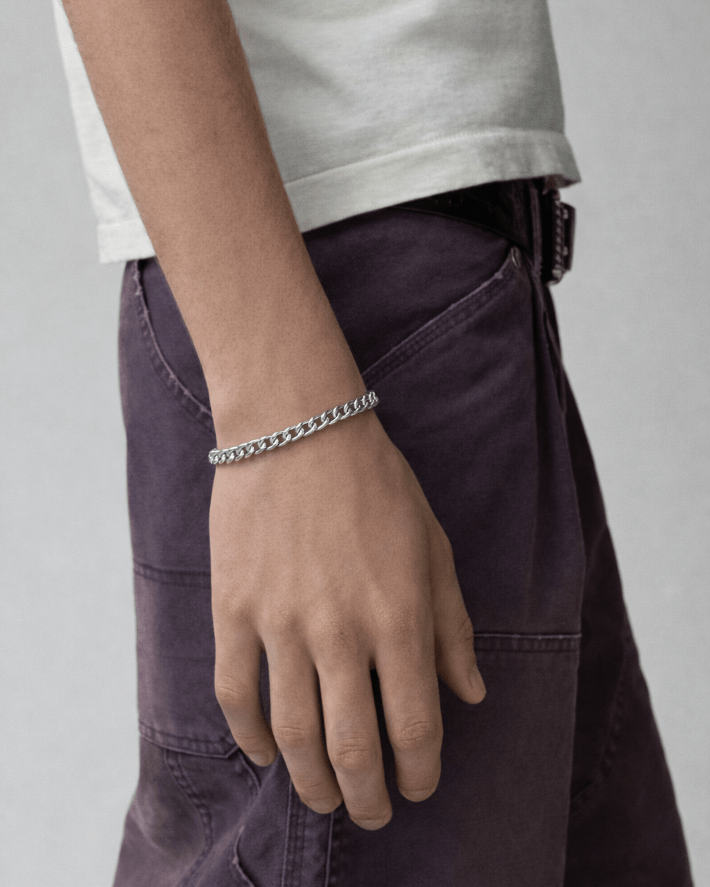 Rynor Cuban Chain Bracelet – silver stainless steel cuban link bracelet, worn by a model