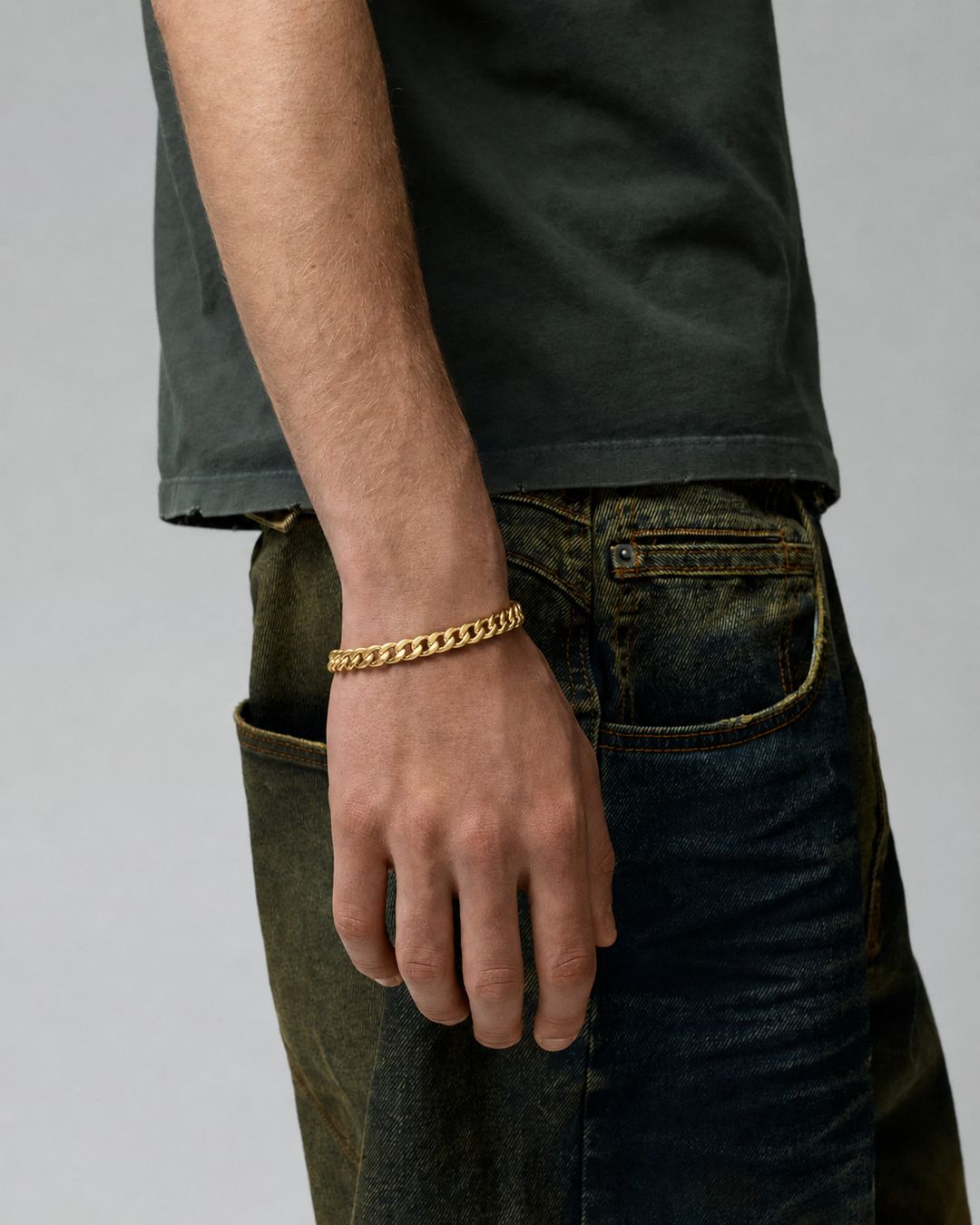 Rynor Curb Chain Bracelet – gold-tone stainless steel curb chain bracelet, worn by a model