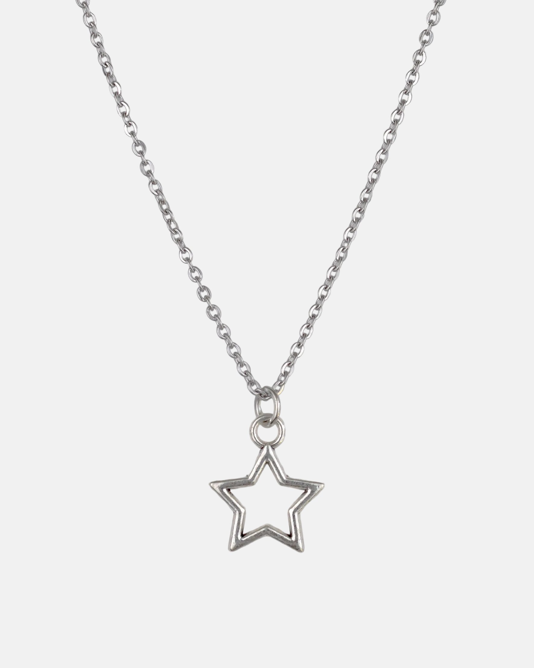Rynor Icon Star Necklace – silver minimal open star pendant necklace, product photo on white background