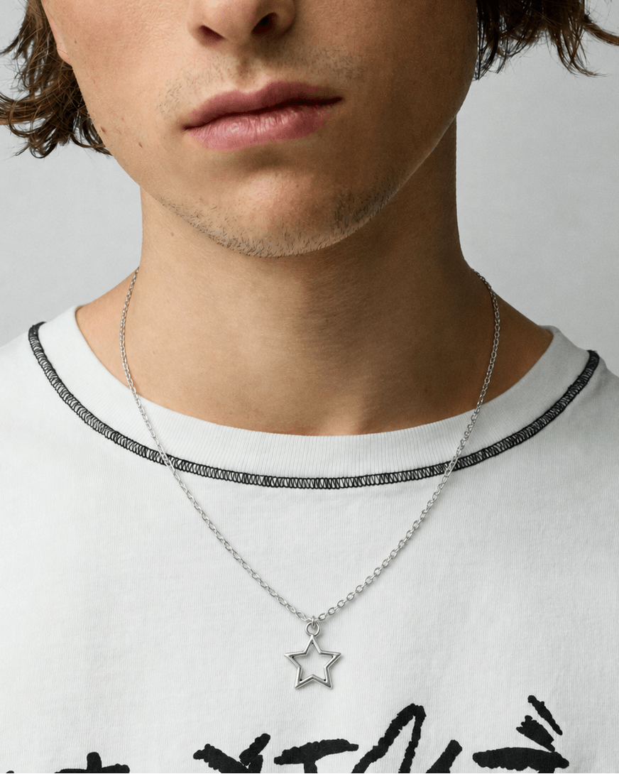 Rynor Icon Star Necklace – silver minimal open star pendant necklace, worn by a model