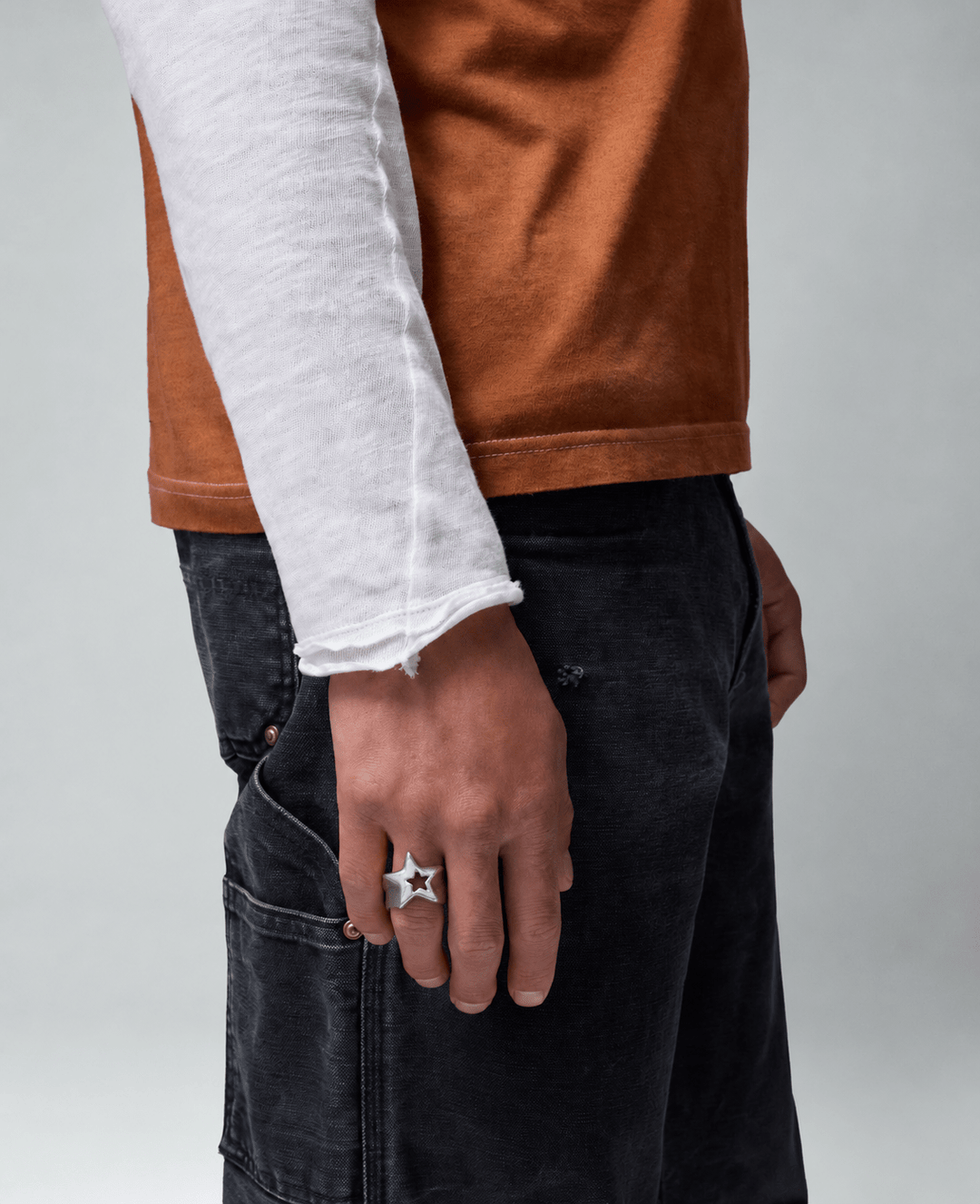 Rynor Icon Star Ring – silver stainless steel hollow star ring, worn by a model