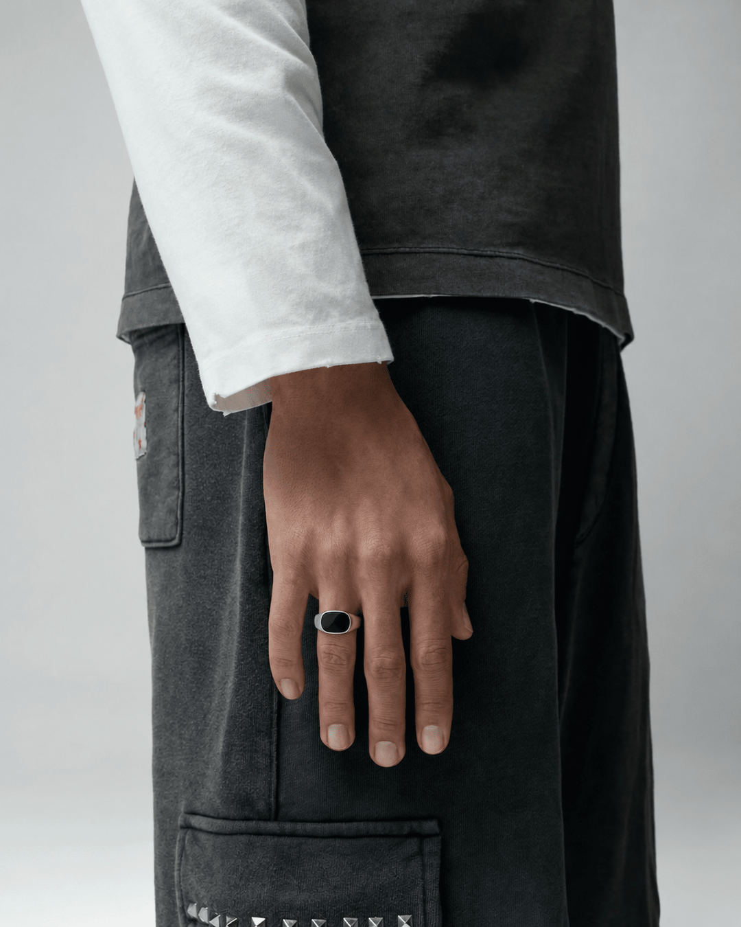 Rynor Midnight Stone Ring – stainless steel signet ring with black oval stone, worn by a model