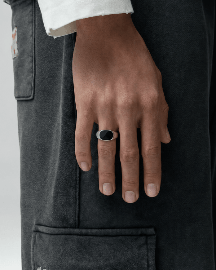 Rynor Midnight Stone Ring – stainless steel signet ring with black oval stone, worn by a model