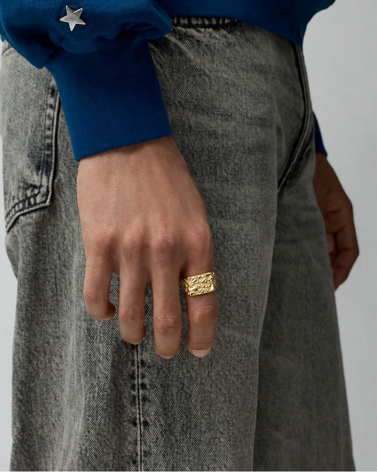 Rynor Molten Texture Ring – gold-tone ring with melted texture, worn by a model
