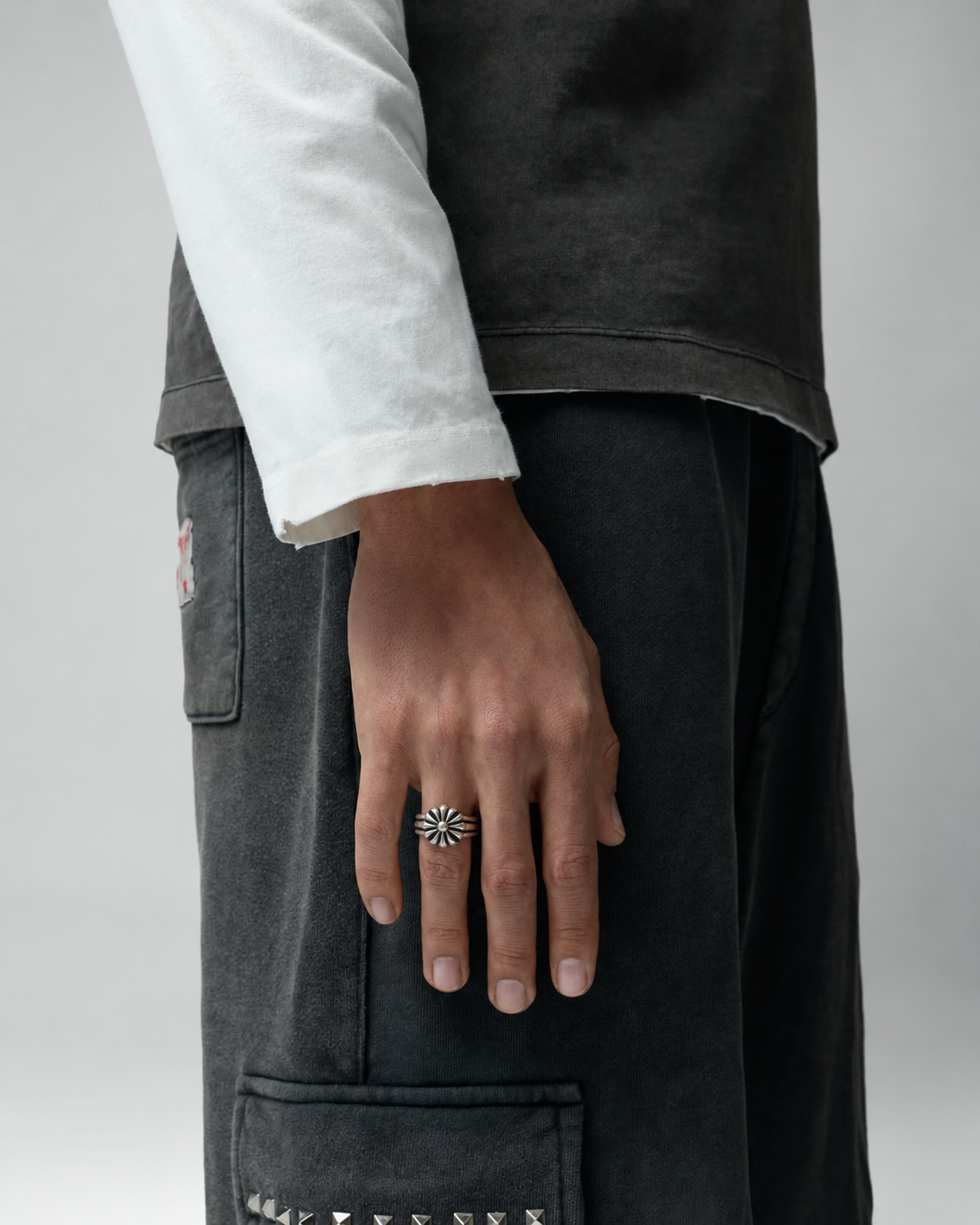 Rynor Rosette Crest Ring – silver stainless steel rosette ring, worn by a model