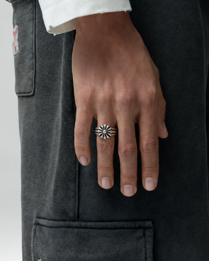 Rynor Rosette Crest Ring – silver stainless steel rosette ring, worn by a model