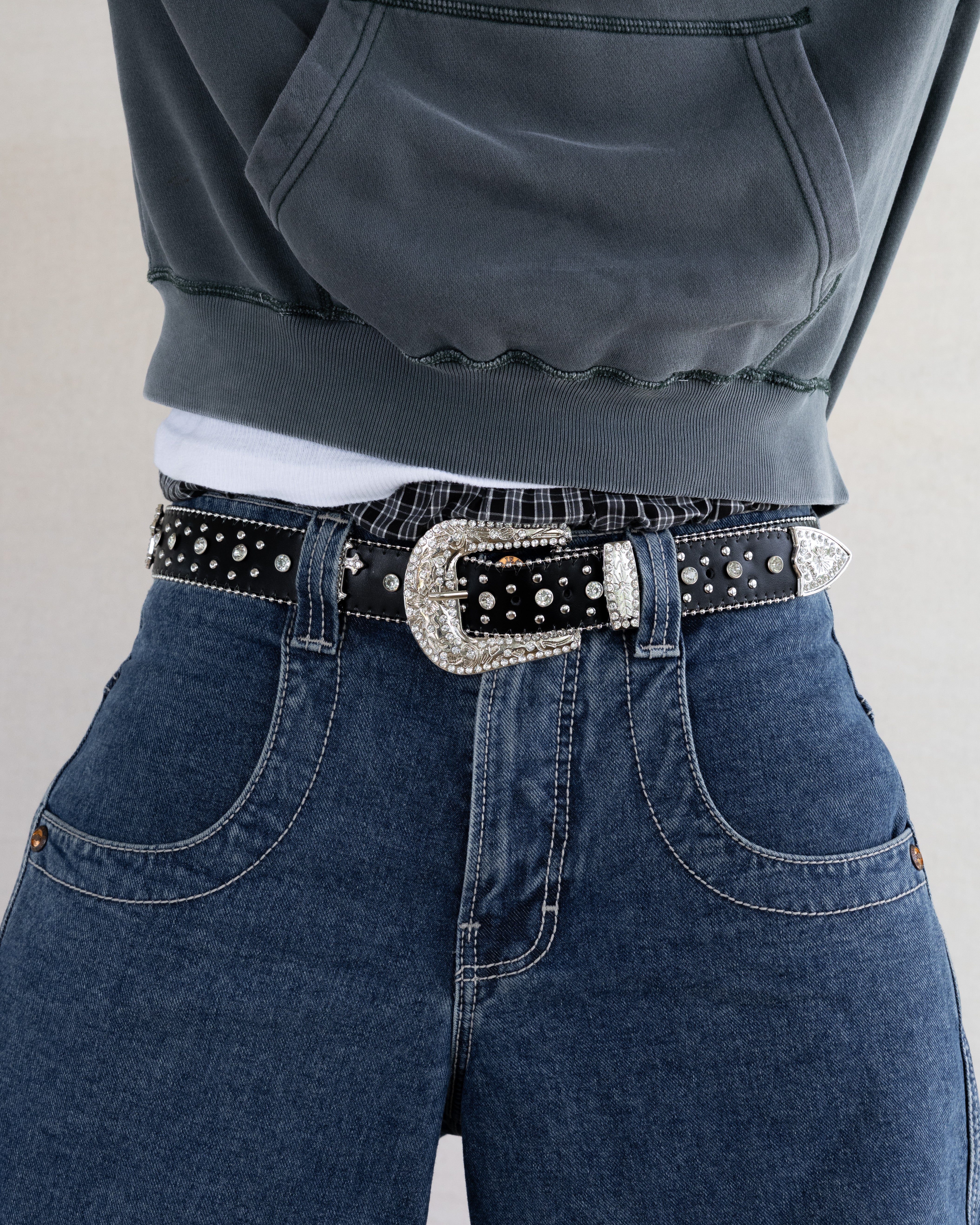 Rynor Saint Shine Belt – black belt with crystal-studded cross buckle, worn by a model