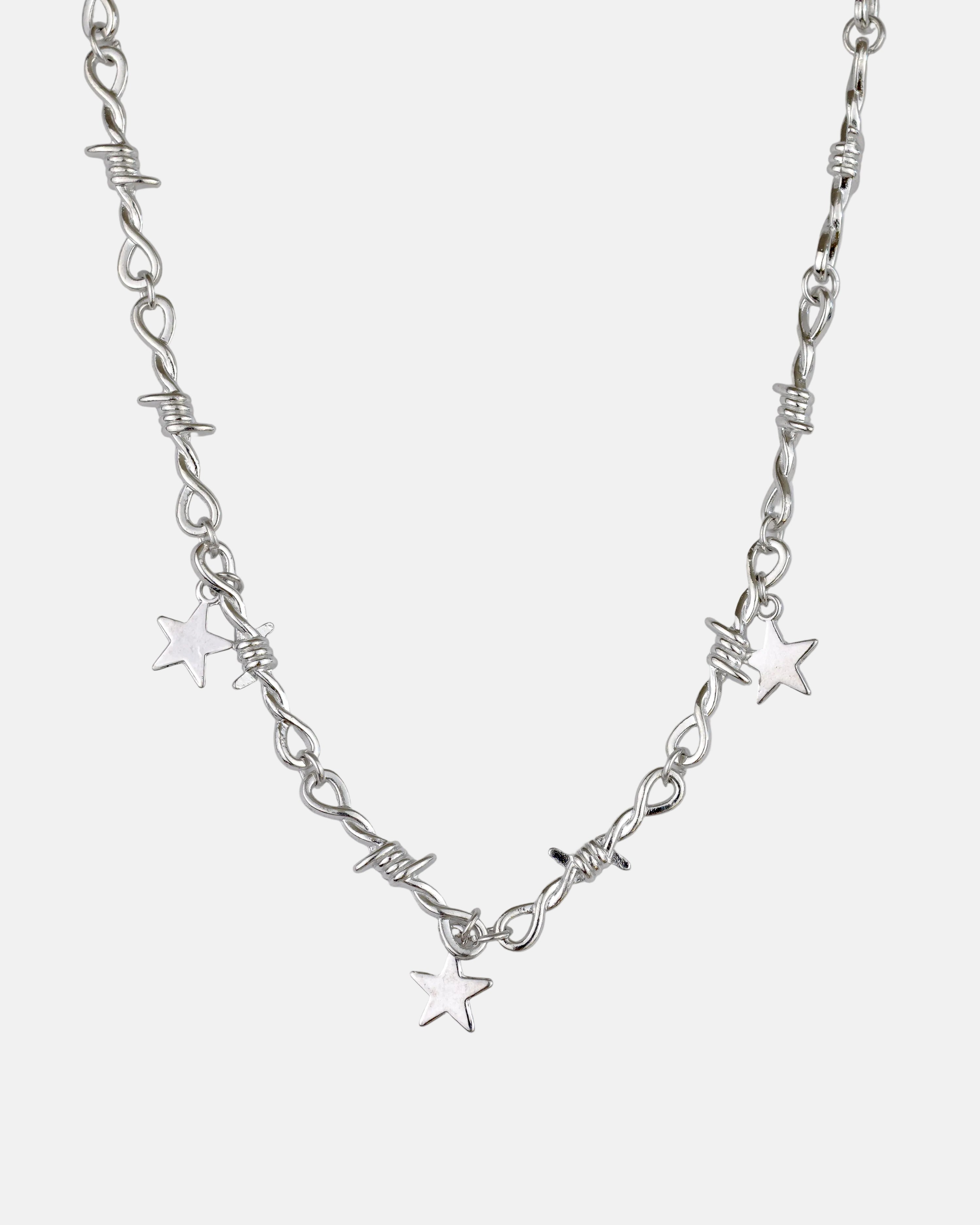 Rynor Star Charm Barbed Necklace – silver barbed wire chain necklace with hanging star charms, product photo on white background