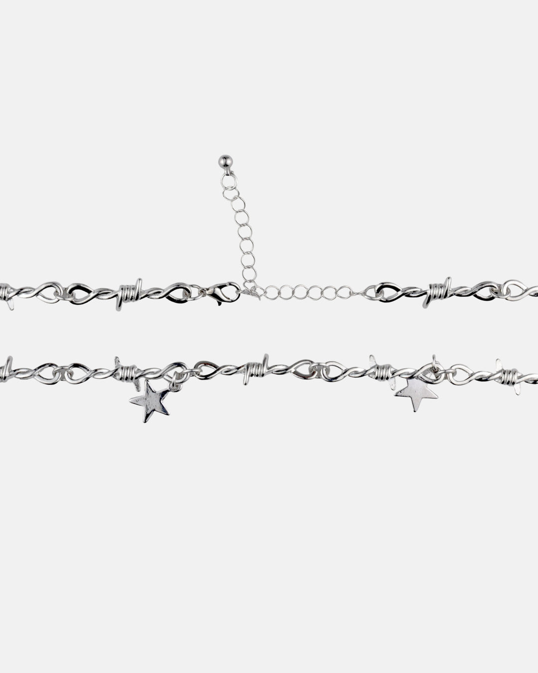 Rynor Star Charm Barbed Necklace – silver barbed wire chain necklace with hanging star charms, worn by a model