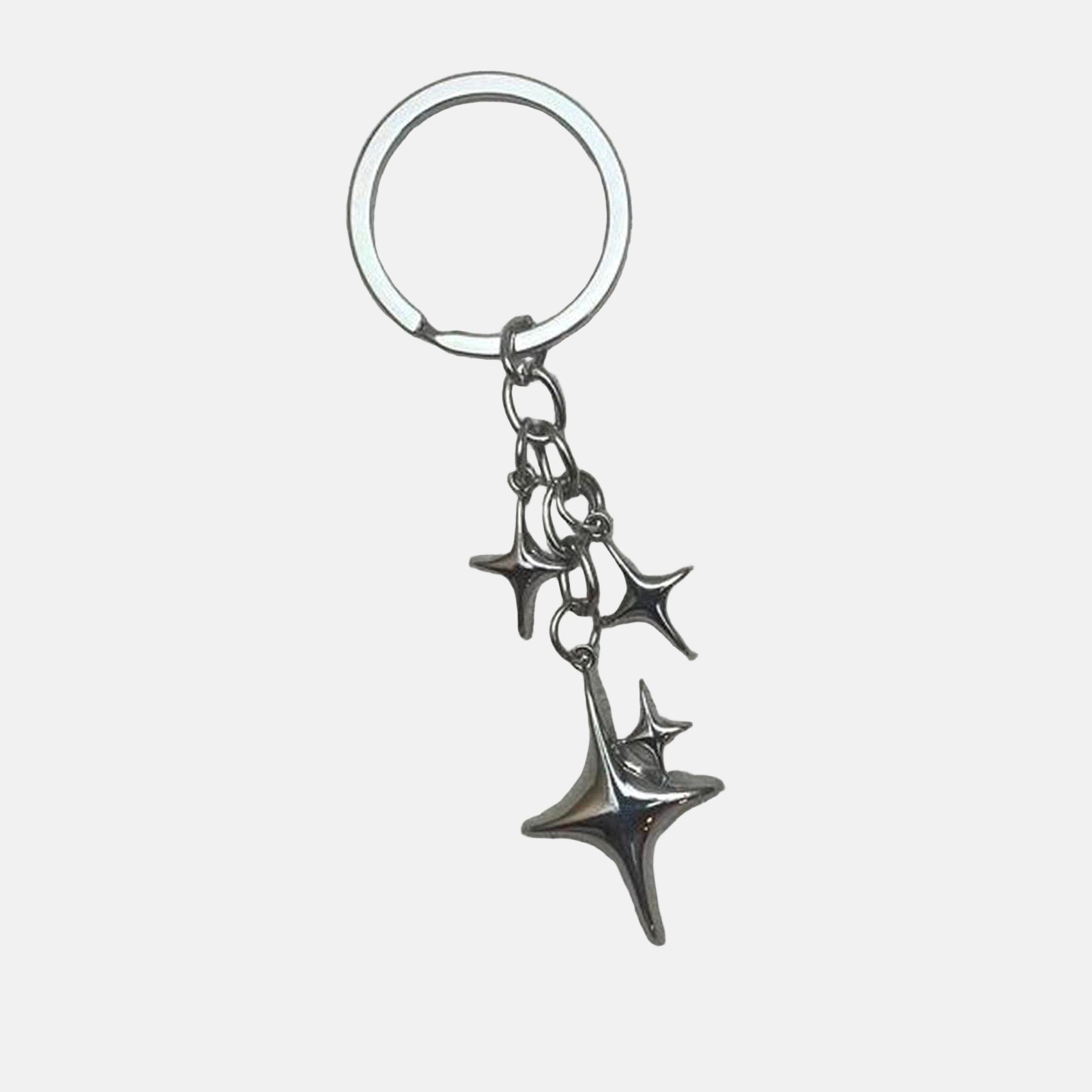 Rynor Star Charm Keychain – silver metal keychain with multiple star charms, worn by a model