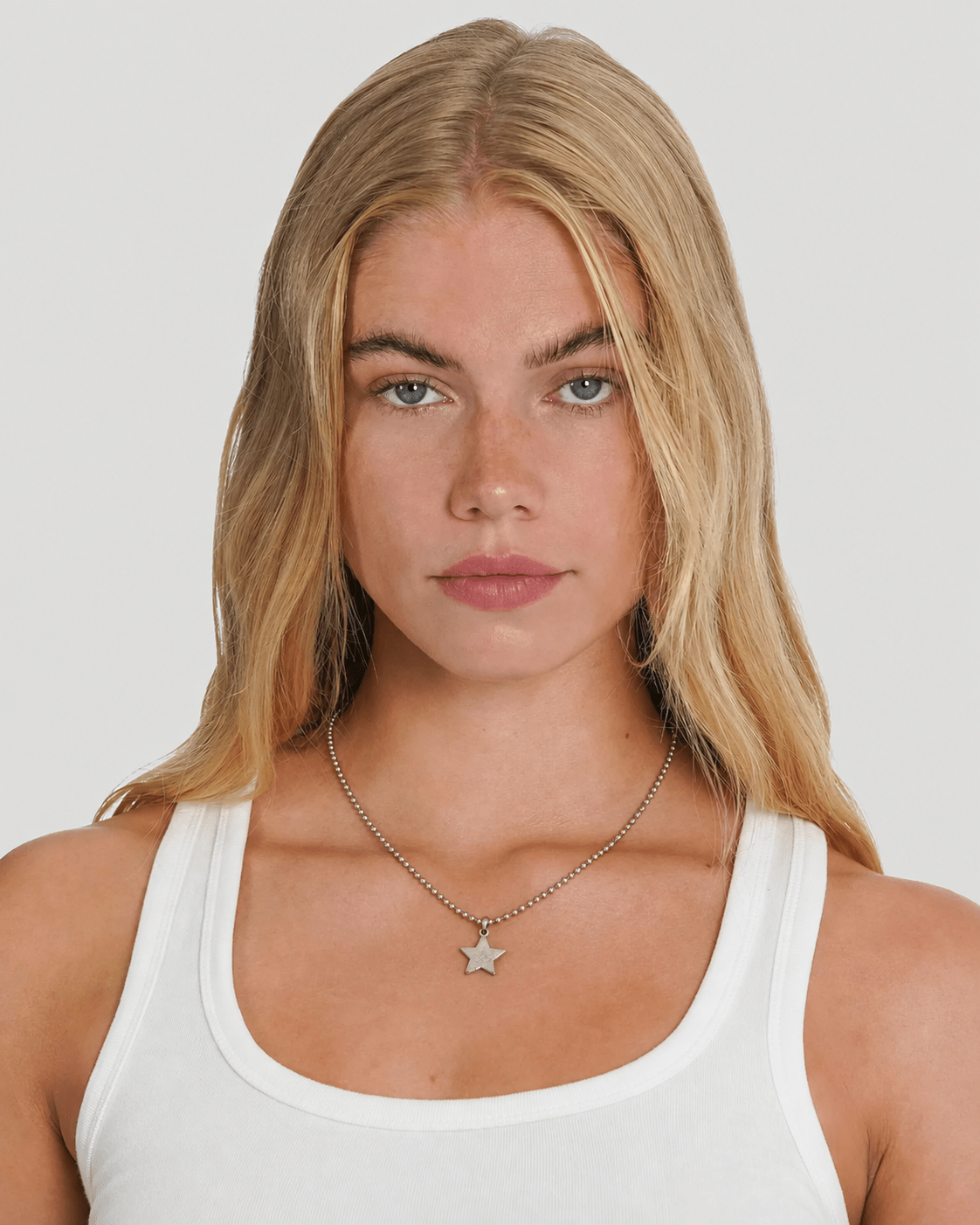 Rynor Star Icon Ball Chain – silver ball chain necklace with star charm, worn by a model