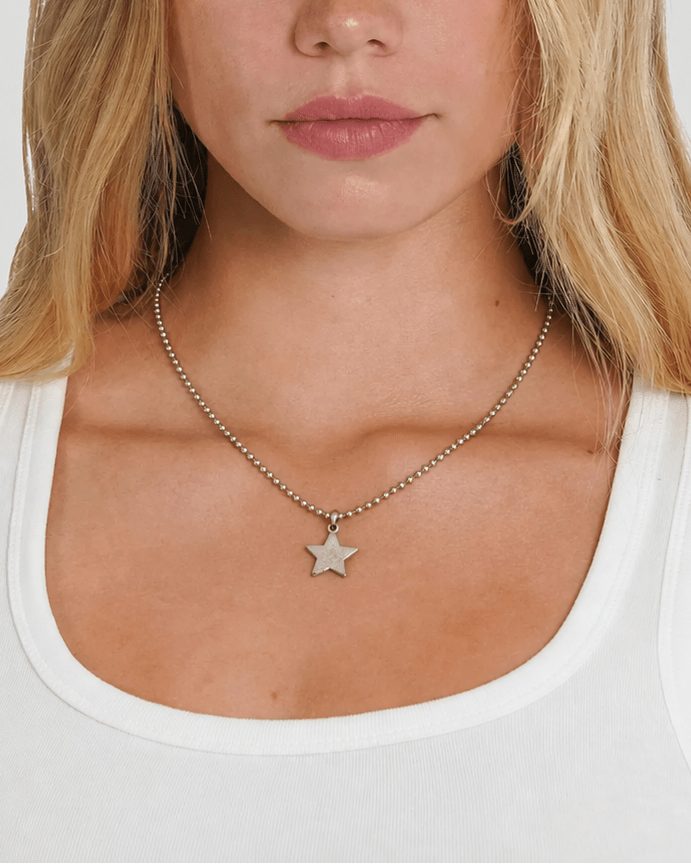 Rynor Star Icon Ball Chain – silver ball chain necklace with star charm, worn by a model