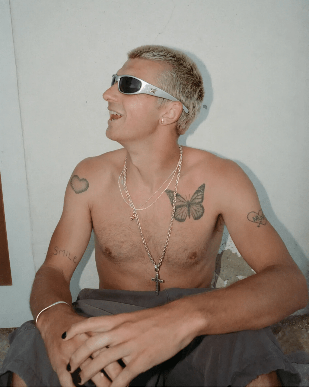 Rynor Superstar Icon Sunglasses – silver wraparound sunglasses with star detailing on the sides, worn by a model