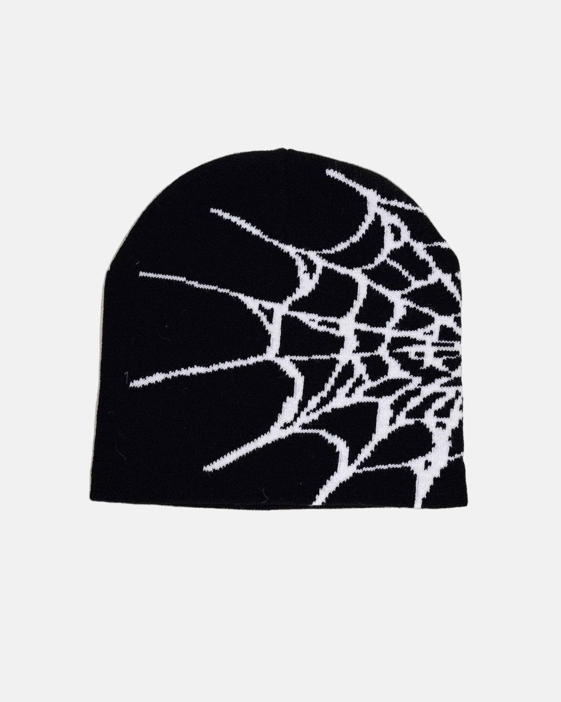 Rynor Web Knit Beanie – black and white spider web pattern knit beanie, product photo on white background